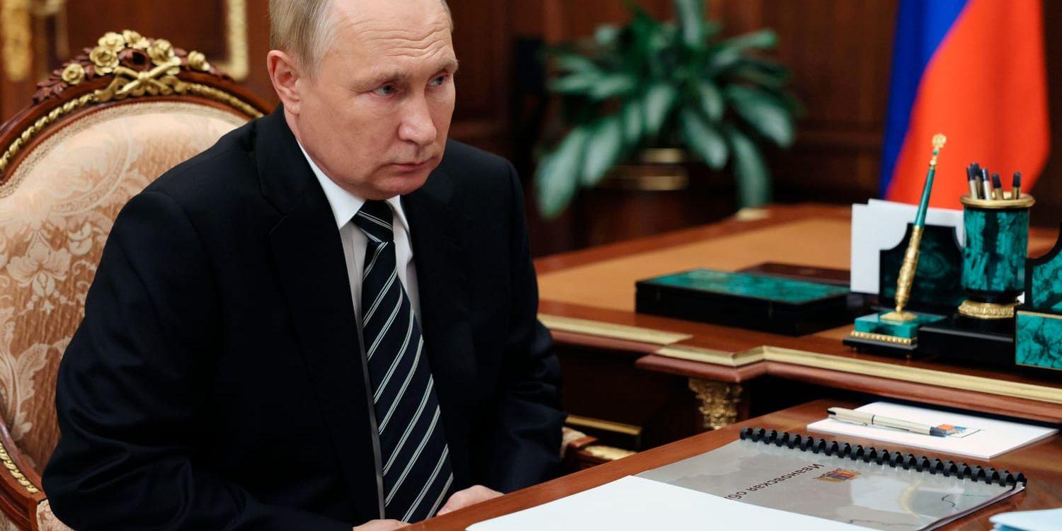 Russian President Vladimir Putin listens to Ivanovo Region Governor Stanislav Voskresensky at Moscow's Kremlin in Moscow, Russia, Tuesday, Oct. 4, 2022. (Gavriil Grigorov, Sputnik, Kremlin Pool Photo via AP)  XAZ120